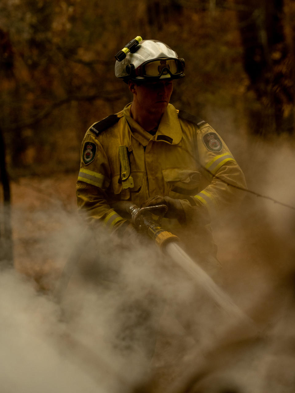 A New South Wales Rural Fire Service (RFS) member fights a fire in Lake Innes, Australia on Dec. 6, 2019. | Michaela Skovranova