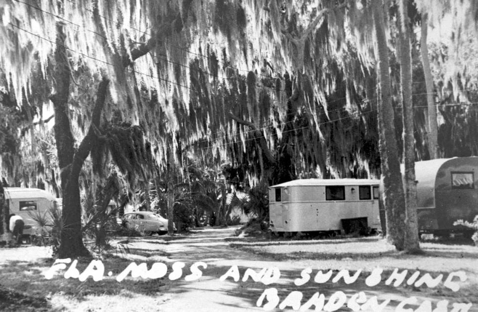 Trailers and automobiles park under the trees at Braden Castle Tourist Camp in 1930. Manatee County Public Library historical digital collection