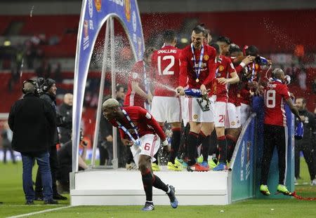 Britain Soccer Football - Southampton v Manchester United - EFL Cup Final - Wembley Stadium - 26/2/17 Manchester United's Zlatan Ibrahimovic sprays Paul Pogba whilst celebrating Reuters / Darren Staples Livepic