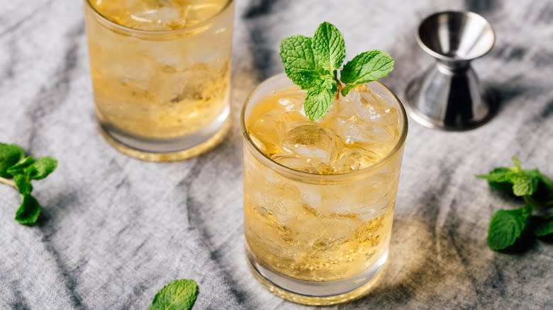 Two glasses of mint bourbon cocktail