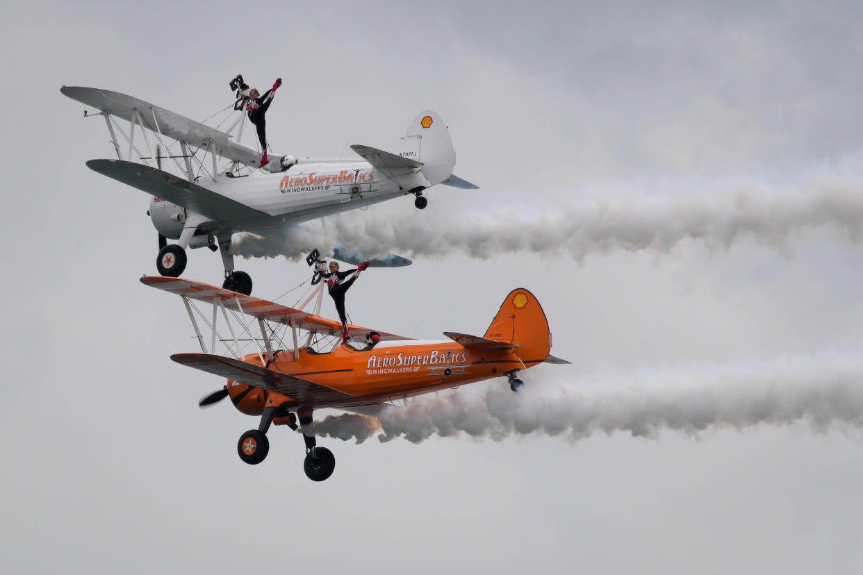 BOURNEMOUTH, ENGLAND - SEPTEMBER 02: AeroSuperBatics Wingwalkers perform during the Bournemouth Air Festival on September 02, 2021 in Bournemouth, England. The air show runs from the 02nd to 05th September and features numerous displays including a performances by the RAFAT Red Arrows, RAF Typhoon, Chinook and full Battle of Britain memorial flight. (Photo by Finnbarr Webster/Getty Images)