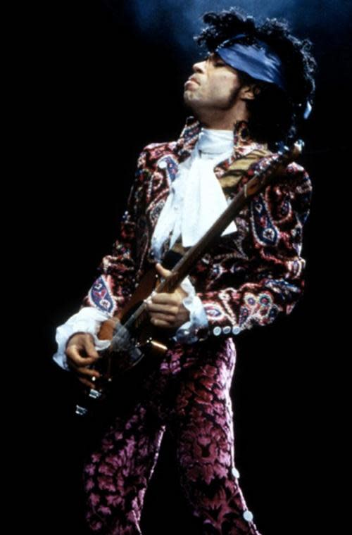 Prince sported a two piece suit- decorated with swirls of raspberry and purple.