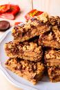 <p>These put all other bars to shame.</p><p>Get the recipe from <a href="https://www.delish.com/cooking/recipe-ideas/a20268441/reeses-stuffed-rice-krispies-treats-recipe/" rel="nofollow noopener" target="_blank" data-ylk="slk:Delish;elm:context_link;itc:0;sec:content-canvas" class="link ">Delish</a><br> </p>