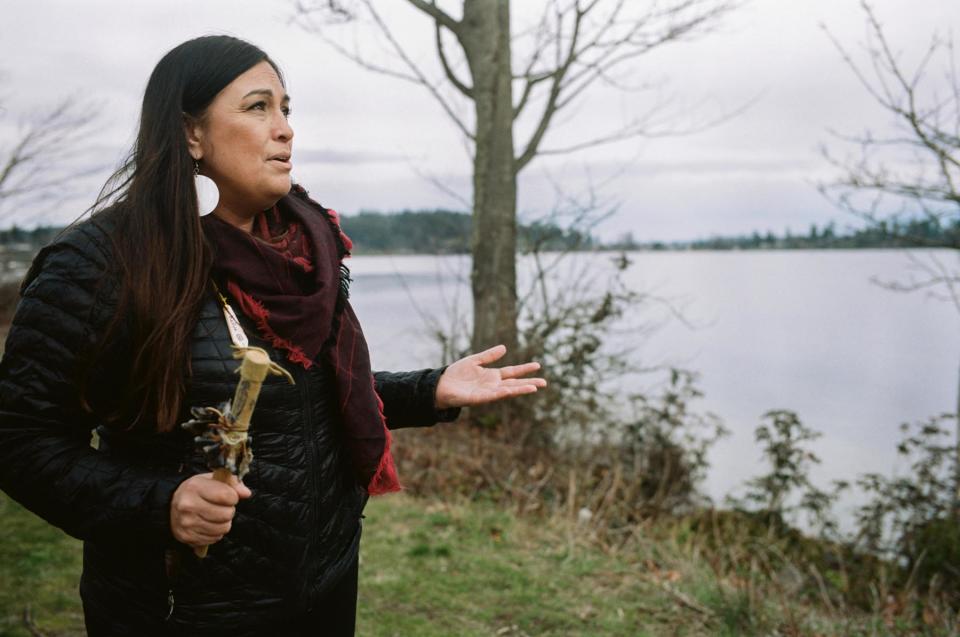 Deborah Parker- CEO, National Native American Indian Boarding School Healing Coalition sings her. native songs in front of the Indian boarding school on the Tulalip Indian Reservation