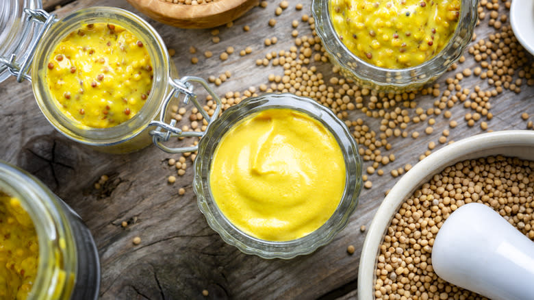 mustards and mustard seeds in bowls