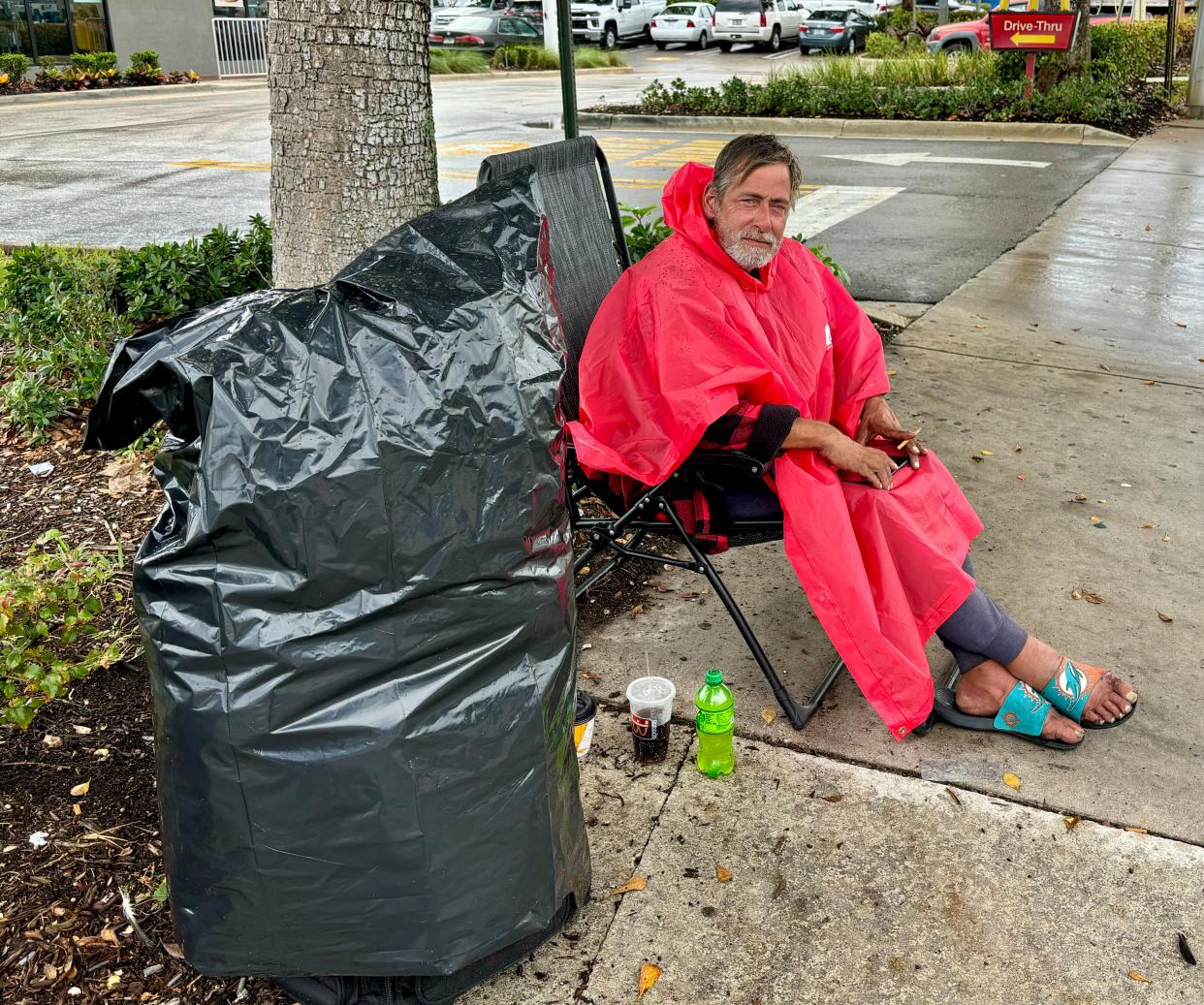 West Palm Beach's Kelly Perkins says he has been homeless for four years and a sidewalk on Belvedere Road is his permanent home.