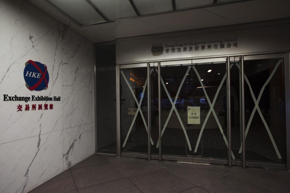 A closed sign is seen at the Hong Kong Stock Exchange after Typhoon Usagi hit Hong Kong