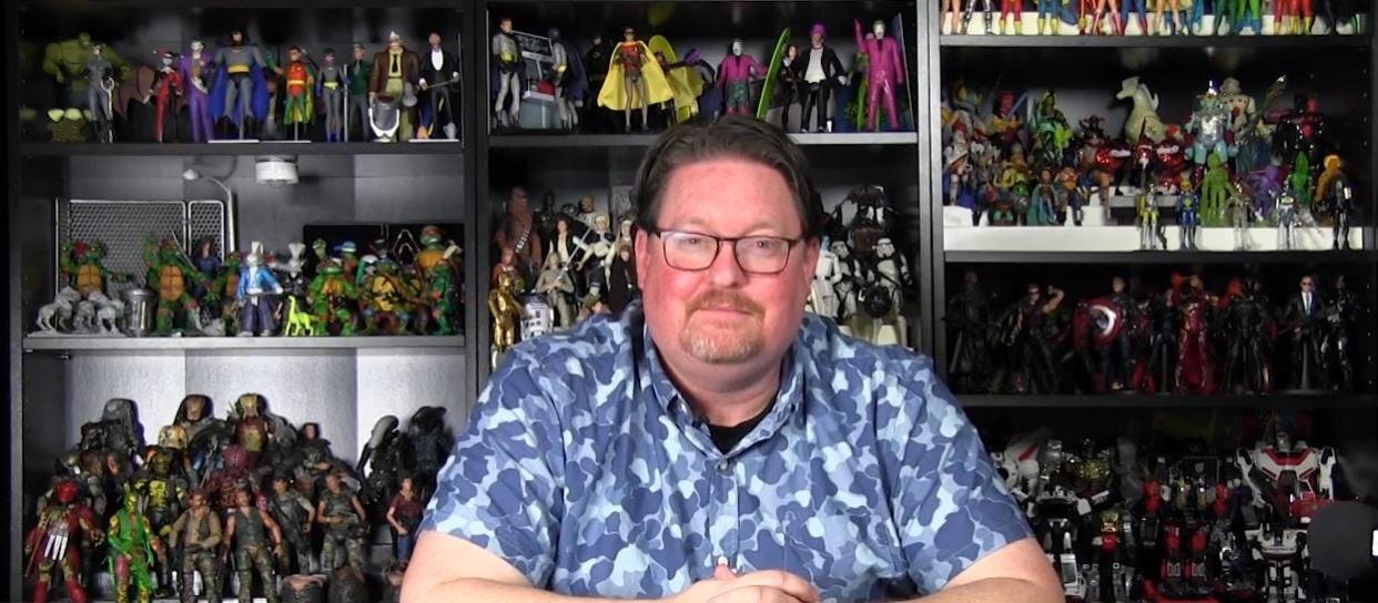 Norwalk resident Daniel Pickett sits in front of his toy and action figure collection. He appears on the third season of "The Toys That Built America" on the History Channel.