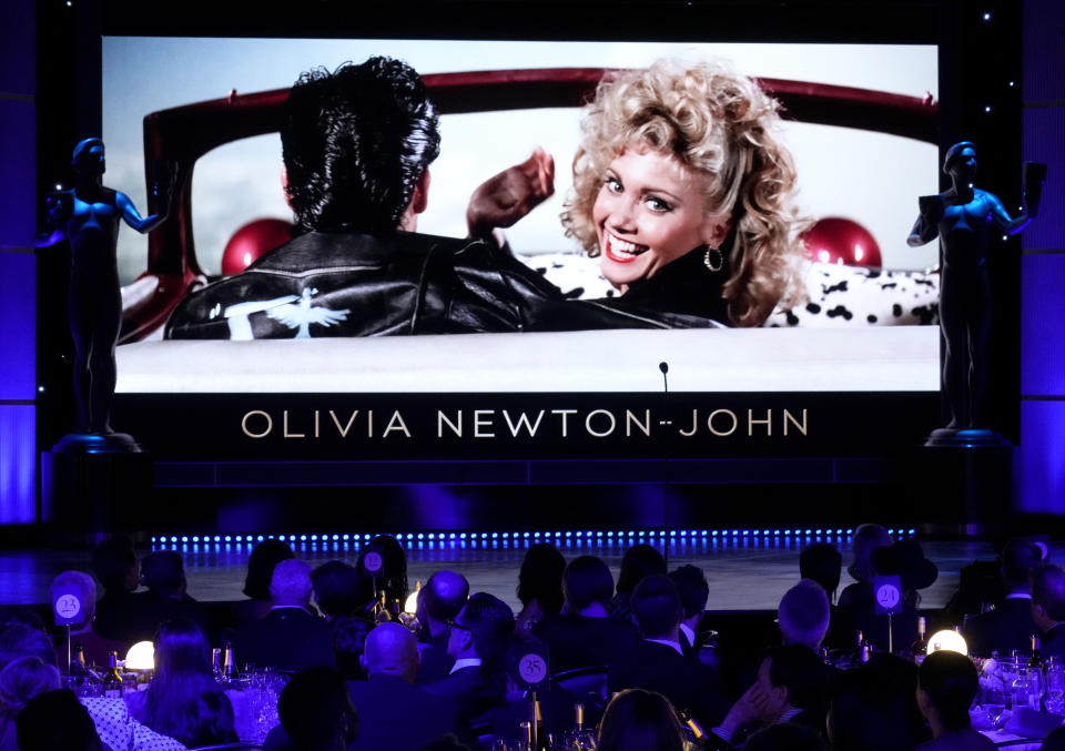 Olivia Newton-John appears on screen during the in memoriam tribute at the 29th annual Screen Actors Guild Awards on Sunday, Feb. 26, 2023, at the Fairmont Century Plaza in Los Angeles. (AP Photo/Chris Pizzello)