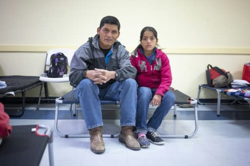 Ovidio Lopez Tum, 53, an asylum seeker from Guatemala, poses for a portrait with his daughter, Ingrid Maribel, 12, inside the church hall of the Basilica of San Albino in Mesilla, New Mexico