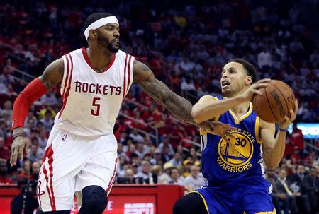 May 23, 2015; Houston, TX, USA; Golden State Warriors guard Stephen Curry (30) looks to shoot as Houston Rockets forward Josh Smith (5) defends during the game in game three of the Western Conference Finals of the NBA Playoffs at Toyota Center. Troy Taormina-USA TODAY Sports