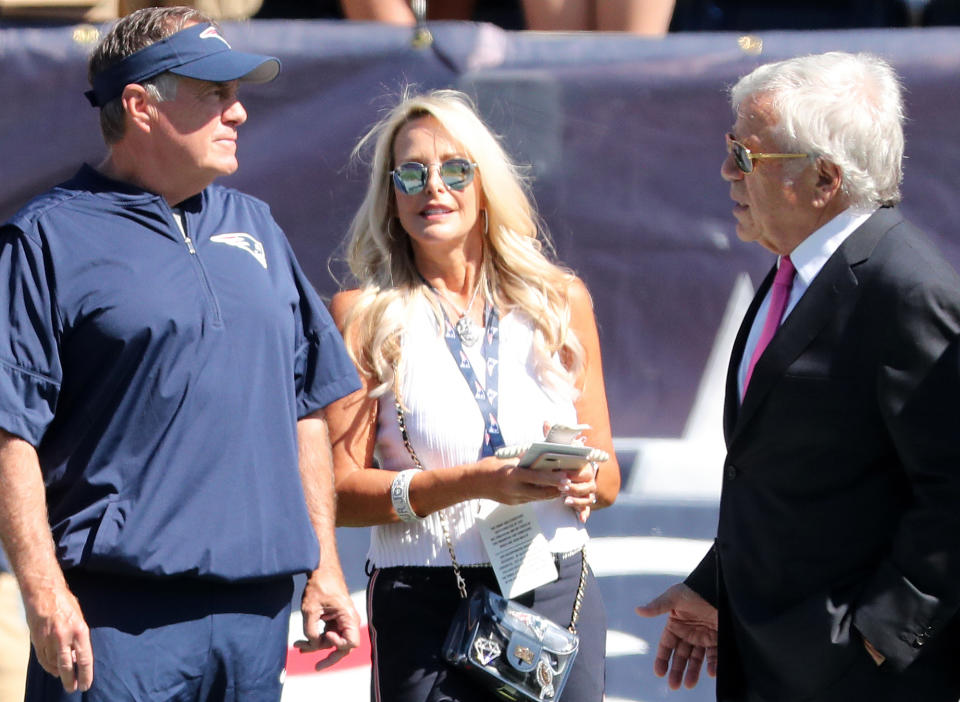 FOXBOROUGH, MA - SEPTEMBER 22: From left, New England Patriots head coach Bill Belichick, his girlfriend Linda Holliday and Patriots owner Robert Kraft stand on the field before the game. The New England Patriots host the New York Jets in a regular season NFL football game at Gillette Stadium in Foxborough, MA on Sep. 22, 2019. (Photo by Matthew J. Lee/The Boston Globe via Getty Images)