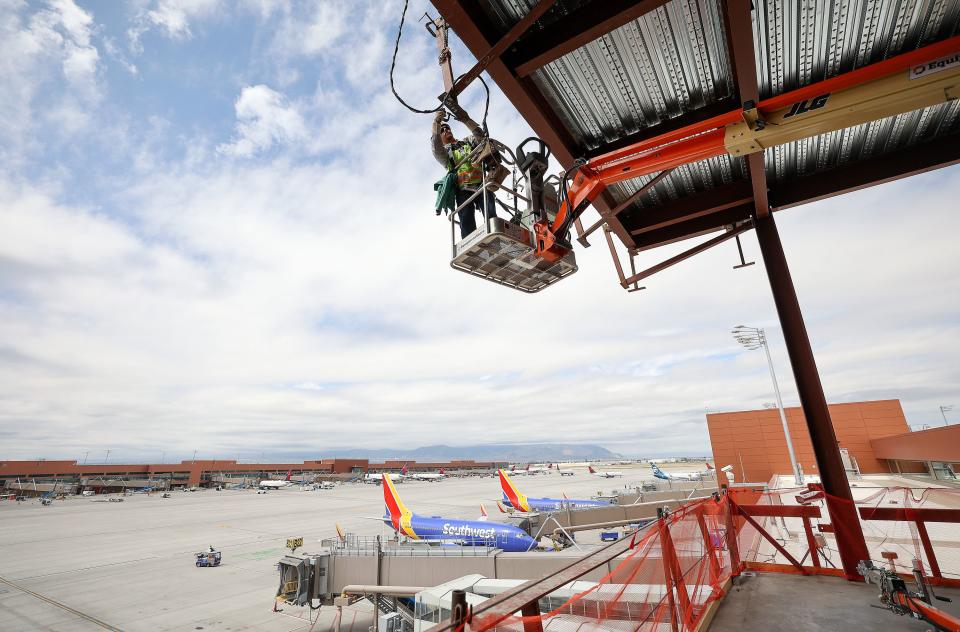 Todd Kendall, SME Steel Contractors union iron worker, welds glass supports during phase three of the Salt Lake City International Airport construction in Concourse B in Salt Lake City on Tuesday, June 20, 2023. | Kristin Murphy, Deseret News