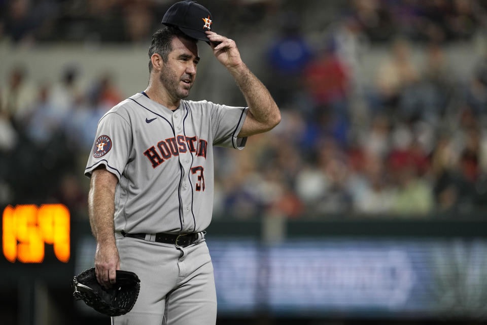 Houston Astros starting pitcher Justin Verlander adjust his cap as he walks off the field after working against the Texas Rangers in the seventh inning of a baseball game, Wednesday, Sept. 6, 2023, in Arlington, Texas. (AP Photo/Tony Gutierrez)