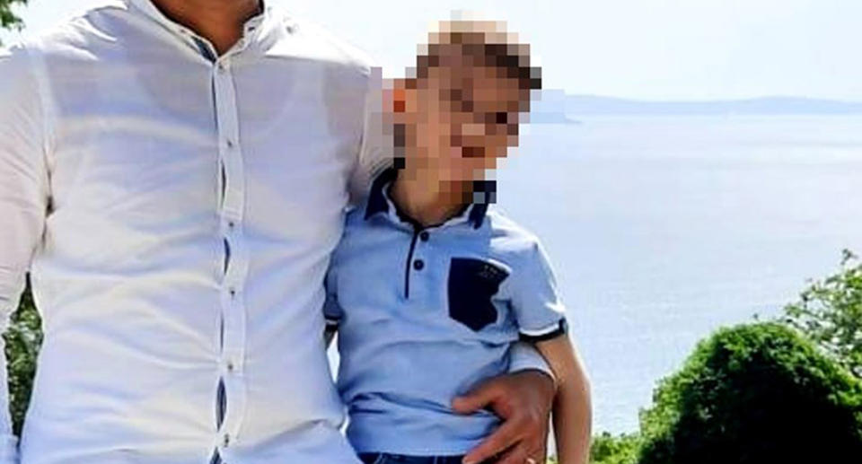 Pictured is a five-year-old boy, whose face is blurred, who died after he was accidentally left in a hot car by his dad.