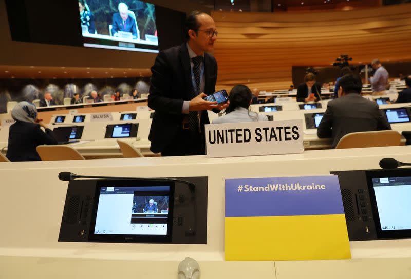 A sign in support of Ukraine is seen at the empty United States desk during the speech of Russian Deputy Foreign Minister Ryabkov attends the Conference on Disarmament in Geneva