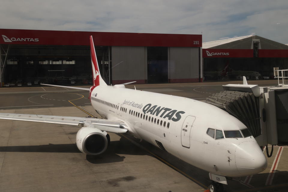 A Qantas plane is seen at a domestic terminal at Sydney Airport in Sydney.