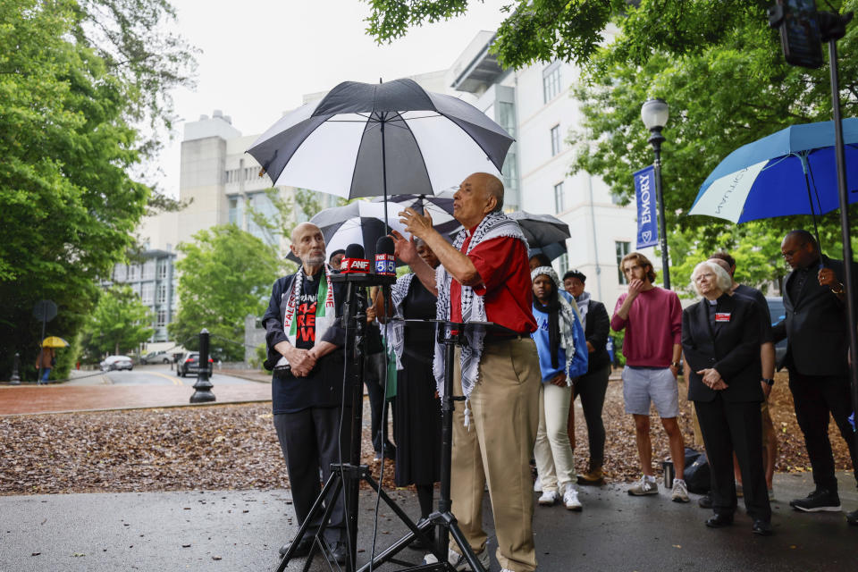 A large group of faith leaders organized by the Atlanta Multifaith Coalition for Palestine address the media during a press conference at Emory on Tuesday, April 30, 2024. They're demanding Biden not to speak at Morehouse commencement unless he calls for an immediate and permanent ceasefire in Gaza. (Miguel Martinez/Atlanta Journal-Constitution via AP)