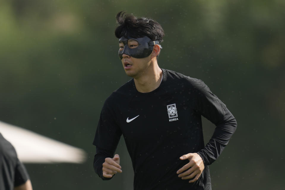 South Korea's Son Heung-min warms up during the South Korea's official training on the eve of the group H World Cup soccer match between South Korea and Portugal, at the Al Egla Training Site 5 in Doha, Qatar, Thursday, Dec. 1, 2022. (AP Photo/Lee Jin-man)