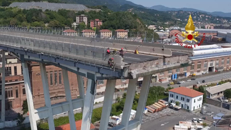 In this frame taken from a video released by the Vigili del Fuoco (Firefighters), an aerial view of the collapsed Morandi highway bridge, in Genoa, Saturday, Aug. 18, 2018. Saturday has been declared a national day of mourning in Italy and includes a state funeral at the industrial port city's fair grounds for those who plunged to their deaths as the 45-meter (150-foot) tall Morandi Bridge gave way Tuesday. (Vigil del Fuoco via AP)