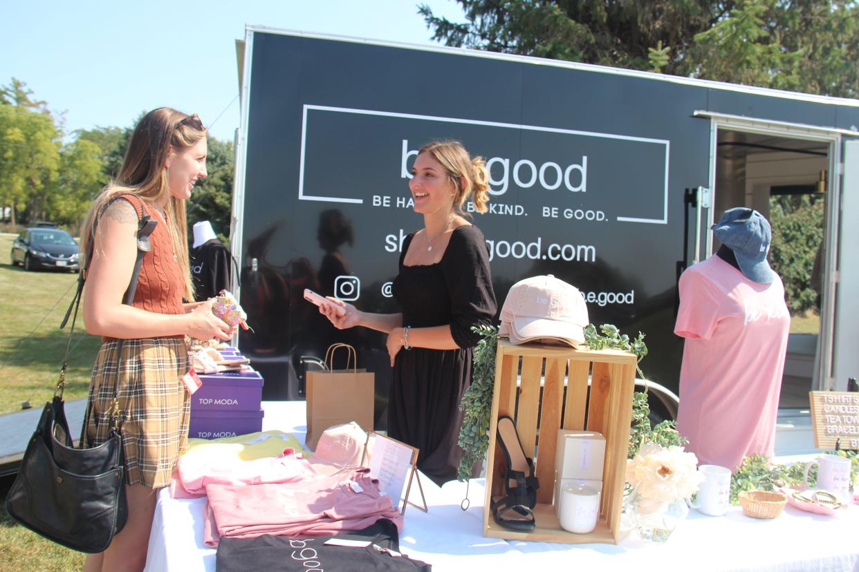 Gabrielle Cowie, of Ankeny, chats with Bridget Good at her b.e. good booth during the Apple Festival on Saturday, Sept. 18, 2021, at Penoach Vineyard and Winery in Adel.