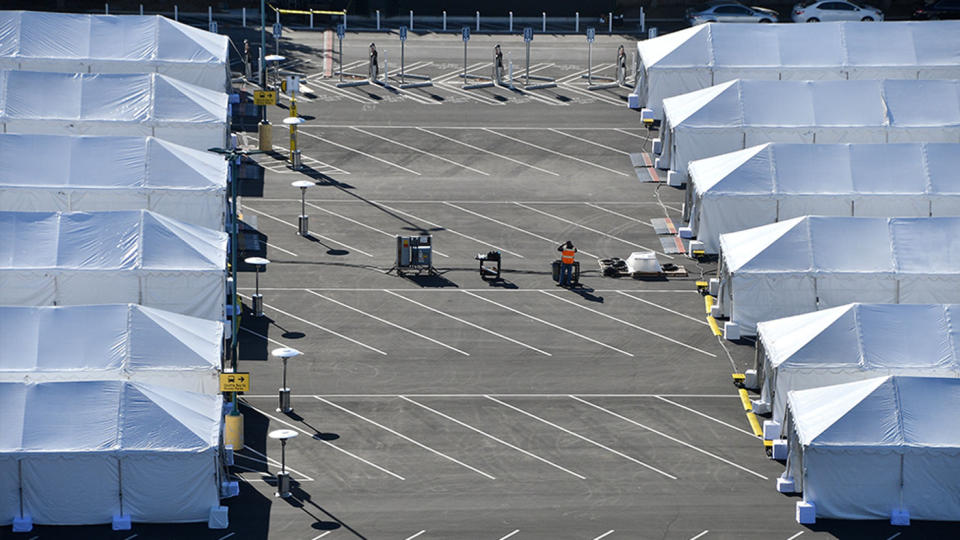 COVID-19 vaccination tents are set up in the north of the Toy Story parking lot at the Disneyland Resort on Tuesday, January 12, 2021, in Anaheim California