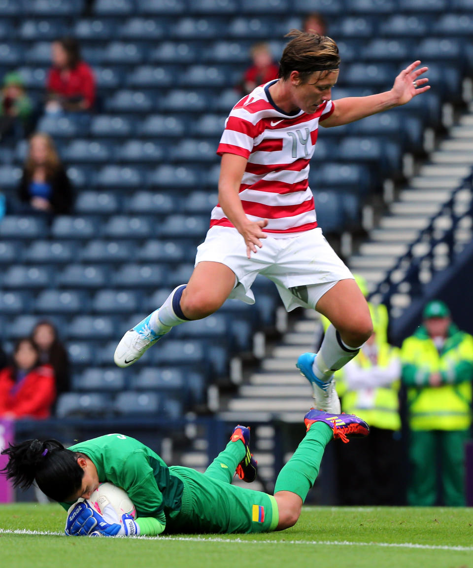 GLASGOW, SCOTLAND - JULY 28: Sandra Sepulveda (L) of Columbia grabs the ball away from Abby Wambach of USA during the Women's Football first round Group G match between United States and Colombia on Day 1 of the London 2012 Olympic Games at Hampden Park on July 28, 2012 in Glasgow, Scotland. (Photo by Stanley Chou/Getty Images)