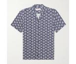 Getting dressed on vacation should be fun—and perhaps a little splurge-worthy. Why not pick up a shirt that looks like it was made for a beachside tiki bar? [$375; mrporter.com]