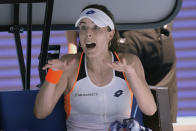 Alize Cornet of France reacts after losing the first set against Danielle Collins of the U.S. during their quarterfinal match at the Australian Open tennis championships in Melbourne, Australia, Wednesday, Jan. 26, 2022. (AP Photo/Simon Baker)