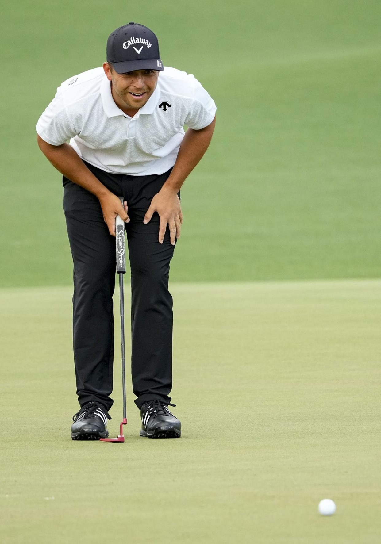Xander Schauffele lines up a putt on No. 2 early in his round Thursday.