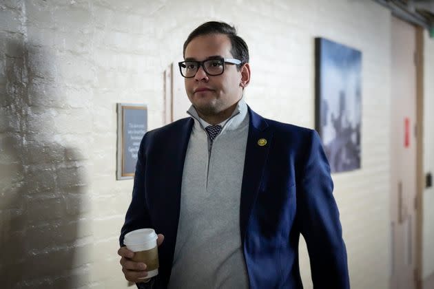 Rep. George Santos (R-N.Y.) heads to a closed-door GOP caucus meeting at the U.S. Capitol on Tuesday.