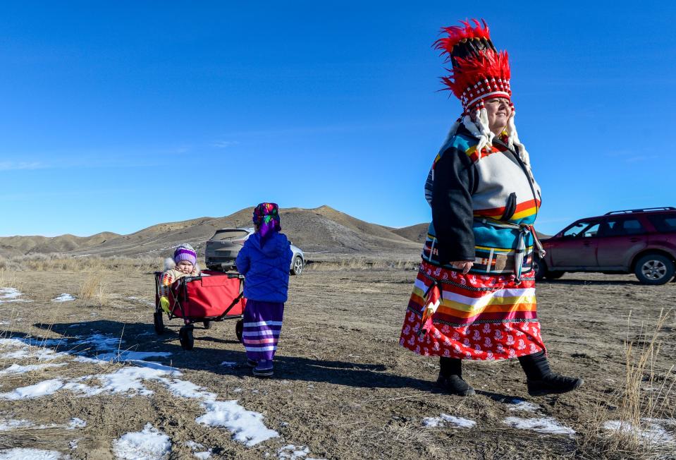 Iva Croff memorializes the Baker Massacre with her grandchildren in 2020.