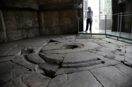 A guard is seen inside the Tower of the Winds, open to the public for the first time in more than 200 years after being restored, in the Roman Agora, in Plaka, central Athens, Greece, August 23, 2016. REUTERS/Michalis Karagiannis