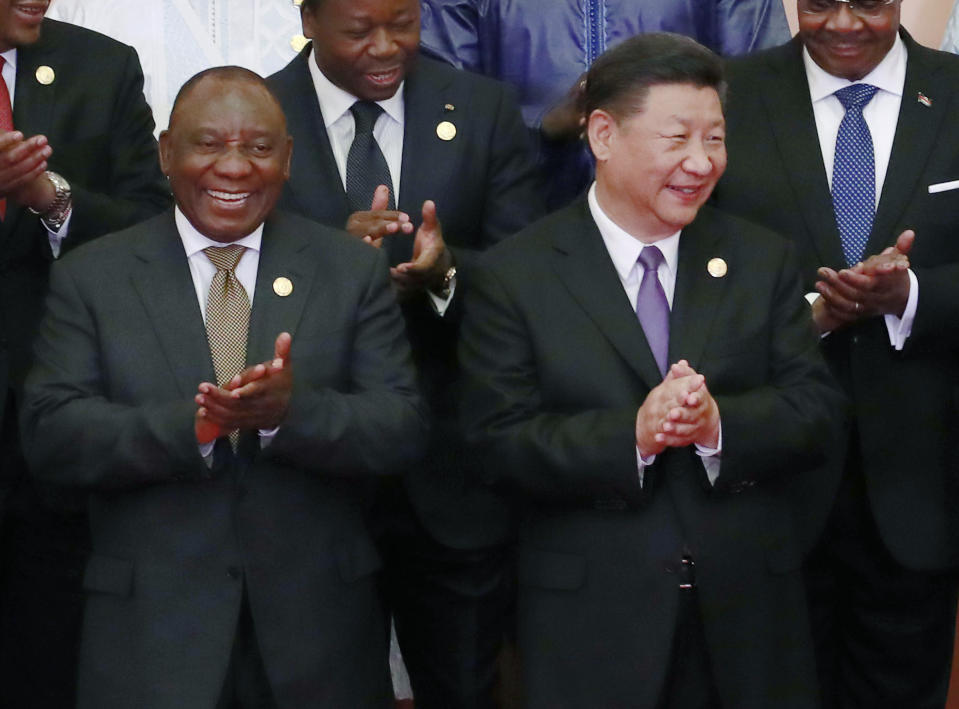 FILE - Chinese President Xi Jinping, right, with South African President Cyril Ramaphosa, left, at the Forum on China-Africa Cooperation in Beijing. China Sept. 3, 2018. Russia and China will look to gain more political and economic ground in the developing world at a summit of the BRICS bloc in South Africa this week. (How Hwee Young/Pool Photo via AP, File)