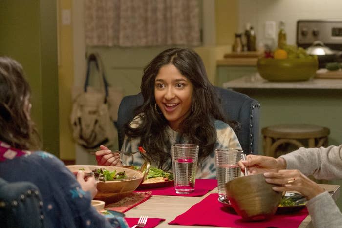 Maitreyi's character eating at the dinner table