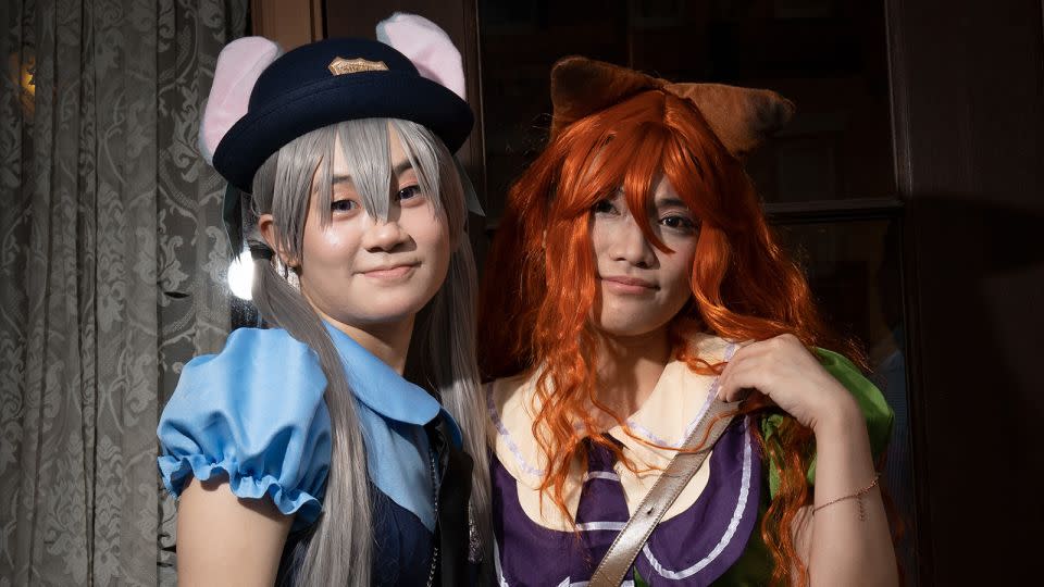 Charmy Chan and her friend Yanni Chung are dressed as Officer Judy Hopps and Nick Wilde from the movie "Zootopia." They bought their costumes off Chinese e-commerce platform Taobao. Chan is a fan of the movie. "I just follow you," said Chung. - Noemi Cassanelli/CNN