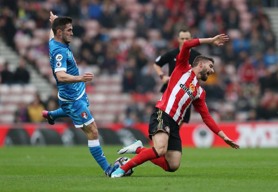 <p>Bournemouth’s Lewis Cook in action with Sunderland’s Fabio Borini </p>