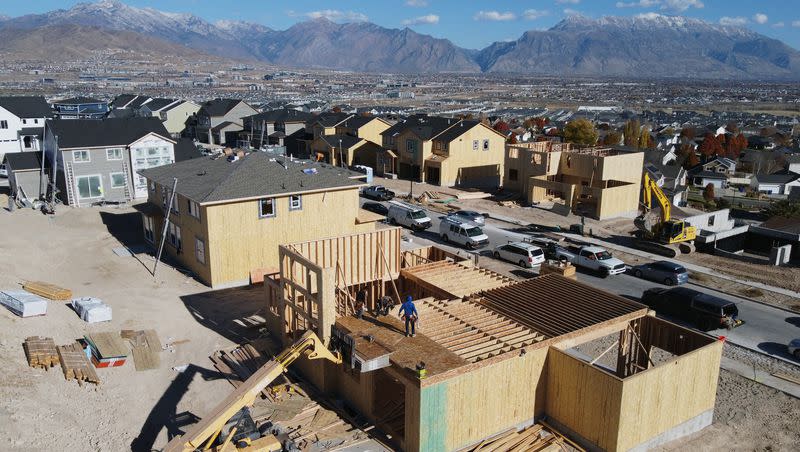 Workers construct single family homes in Saratoga Springs area on Tuesday, Nov. 14, 2023.