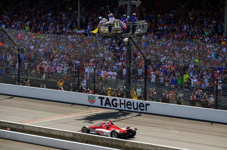 Marcus Ericsson reaches the finish line under the yellow flag Sunday to win the 106th Indianapolis 500.