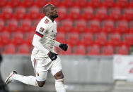 Belgium's Romelu Lukaku celebrates after scoring his side's first goal during the World Cup 2022 group E qualifying soccer match between Czech Republic and Belgium at the Sinobo stadium in Prague, Czech Republic, Saturday, March 27, 2021. (AP Photo/Petr David Josek)