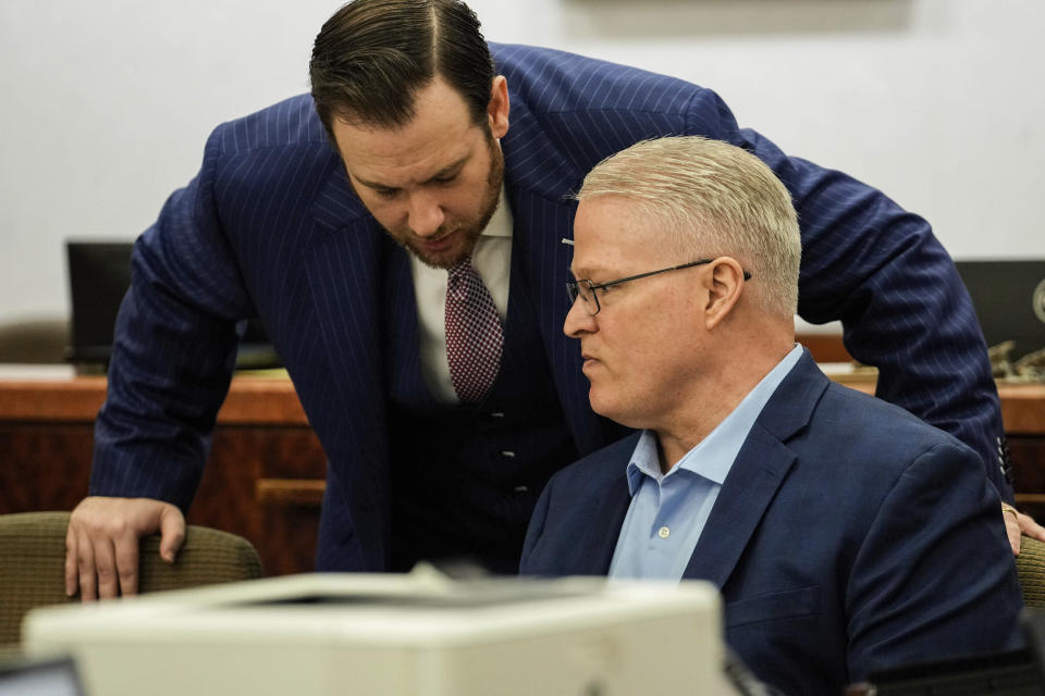 Defense attorney Romy Kaplan, left, speaks to client David Temple during his sentencing trial in the Harris County 178th District Criminal Court Monday April 10, 2023 in Houston. David Temple was convicted for the second time for the murder of his pregnant wife, Belinda Lucas Temple, in Aug. 2019, but the sentencing was postponed due to the COVID-19 pandemic. (Raquel Natalicchio/Houston Chronicle via AP)