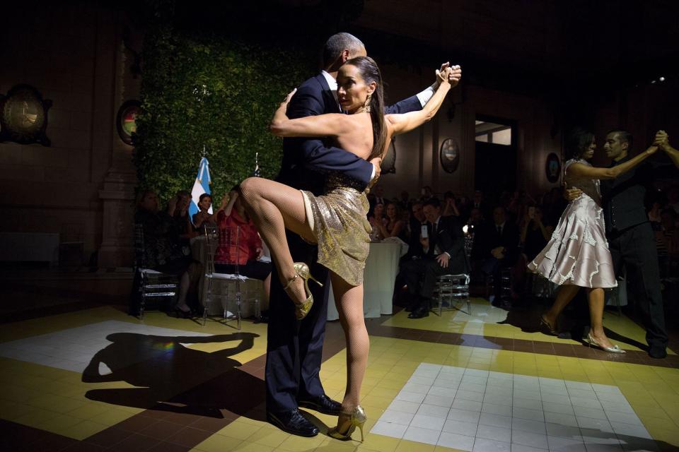 The president and first lady dance with renowned tango-dancers Mora Godoy and Jose Lugone in Buenos Aires on March 23.