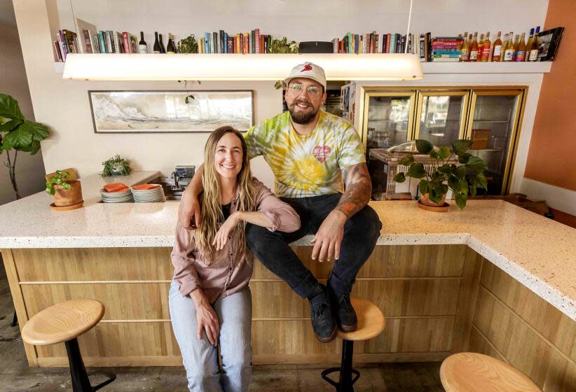 LOS ANGELES CA - APRIL 04, 2021 - Husband and wife team Sabrina and Spencer Bezaire at their restaurant Eszett in Silver Lake. Their restaurantN like so manyN was struggling during the pandemic and the proprietors were trying to figure out how to keep it afloat. What they came up with is a hot sauce, which has, at the very least, been helping their finances. Chef Spencer Bezaire only makes a new batch every two weeks or so and that is happening today, April 6. (Ricardo DeAratanha / Los Angeles Times)