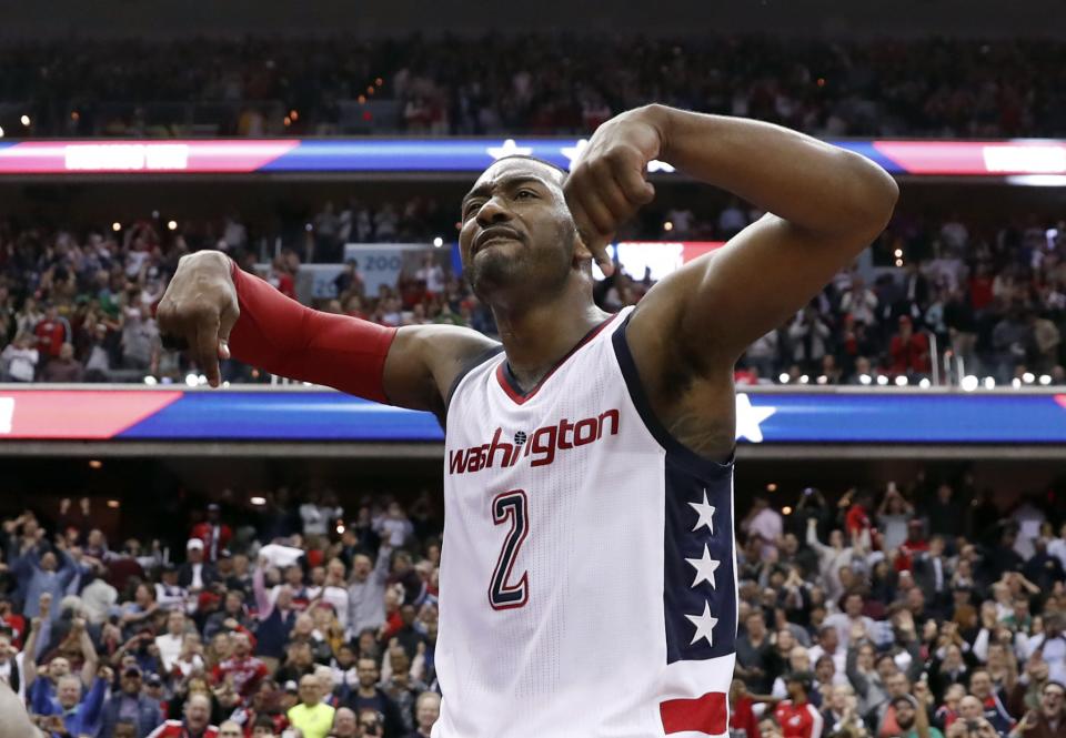 John Wall felt all the emotions after his game-winning shot Friday night. (AP)