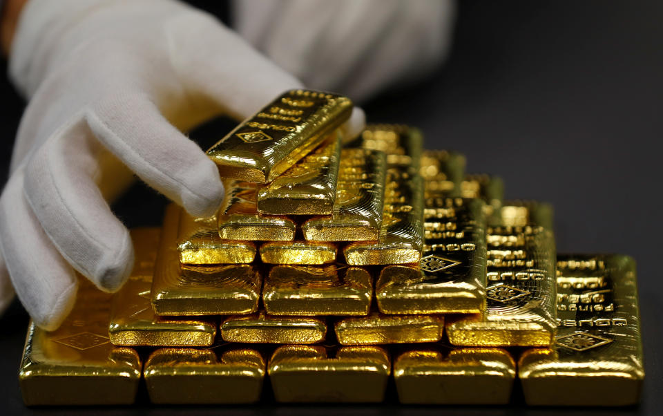 An employee sorts gold bars in the Austrian Gold and Silver Separating Plant 'Oegussa' in Vienna, Austria, December 15, 2017.  REUTERS/Leonhard Foeger