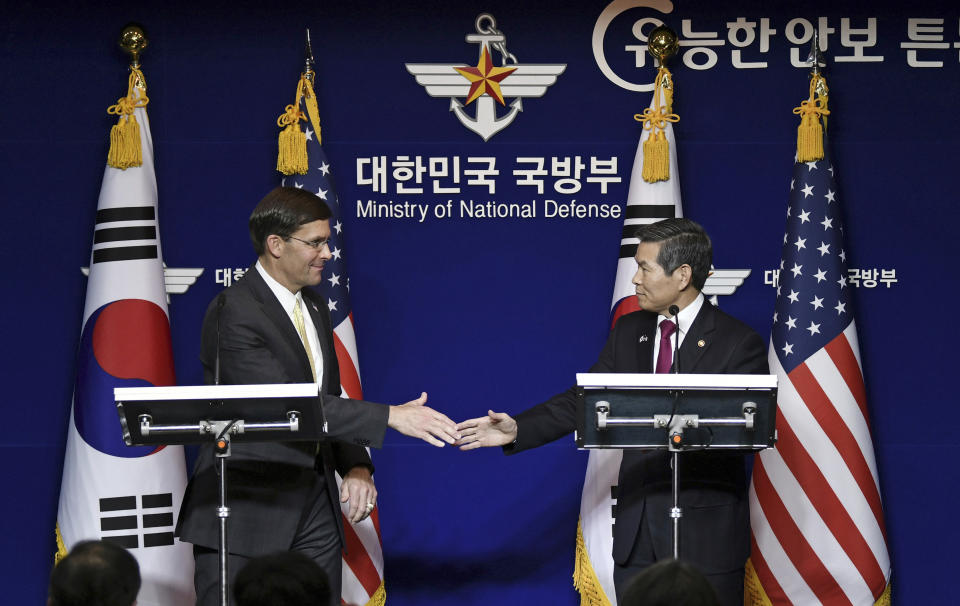 U.S. Defense Secretary Mark Esper, left, and South Korean Defense Minister Jeong Kyeong-doo, hold a joint press conference after the 51st Security Consultative Meeting (SCM) at the Defense Ministry in Seoul Friday, Nov. 15, 2019. U.S. Defense Secretary Esper says South Korea is wealthy enough to pay a bigger share of the cost of having U.S. troops on its soil. (Jung Yeon-je/Pool Photo via AP)