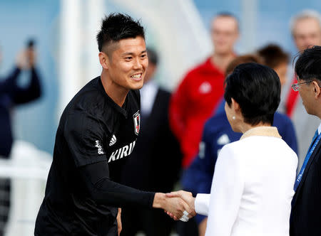 Soccer Football - World Cup - Japan Training - Japan Training Camp, Kazan, Russia - June 21, 2018 Japan's Princess Takamado shakes hands with Eiji Kawashima during training REUTERS/John Sibley