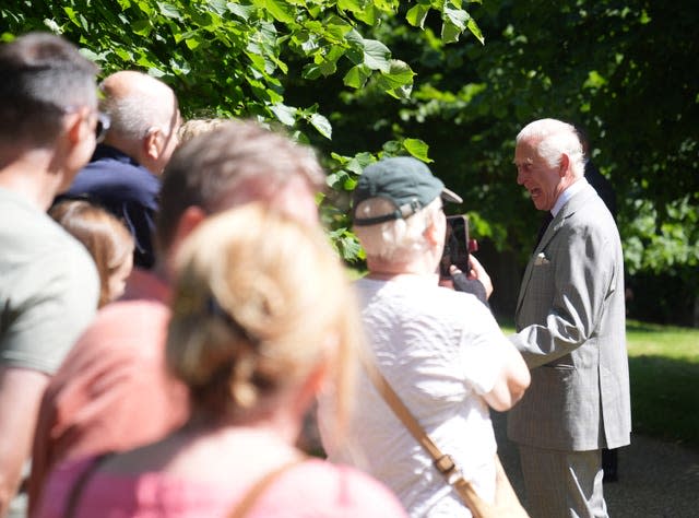 King Charles III speaks with well wishers after attending a Sunday church service at St Mary Magdalene Church in Sandringham, Norfolk