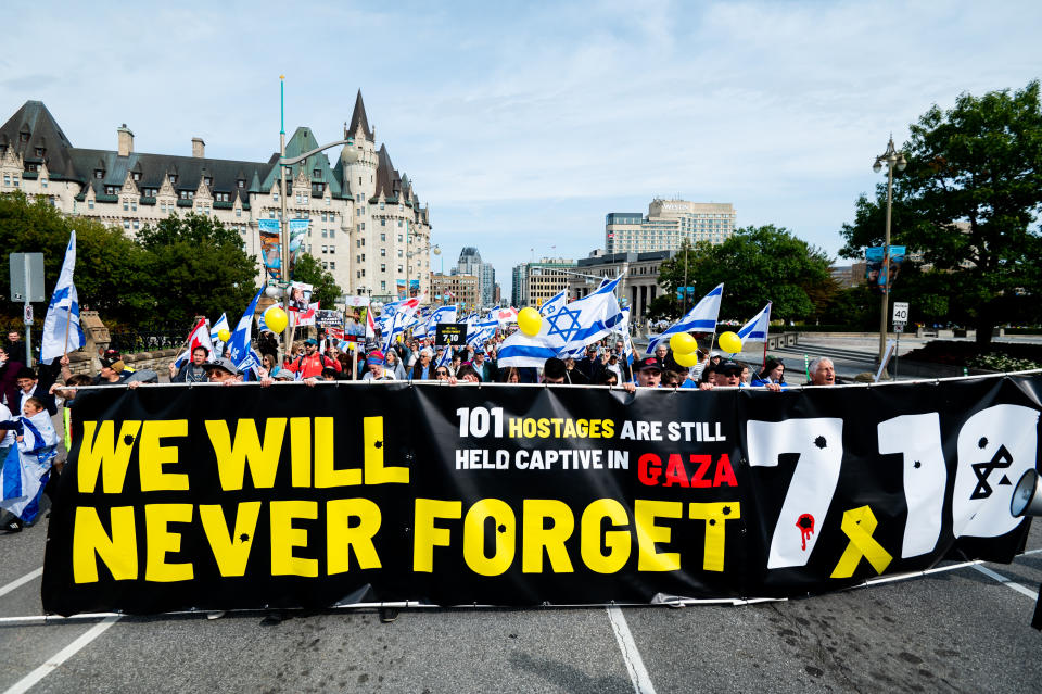 Pro-Israel protestors march towards Parliament Hill from Ottawa City Hall during a ceremony in Ottawa on Sunday, Oct. 6, 2024. Monday marks one-year since the beginning of hostilities between Israel and Palestine. THE CANADIAN PRESS/Spencer Colby