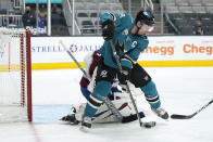 San Jose Sharks center Logan Couture (39) tries to score against Colorado Avalanche goaltender Philipp Grubauer (31) during the first period of an NHL hockey game in San Jose, Calif., on Wednesday, May 5, 2021. (AP Photo/Tony Avelar)